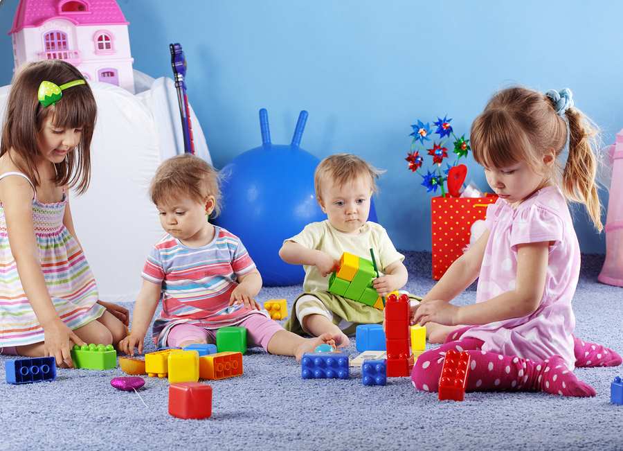 bigstock-Group-of-kids-playing-with-con-12140777
